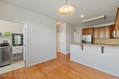 Step into sophistication with this beautifully designed End-Unit on Country Club of the Poconos Golf Course in Pennsylvania - for sale on GolfHomes.com, golf home, golf lot