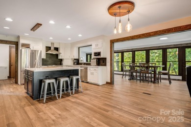 Welcome to this beautifully updated 4-bedroom, 4-bath home on Rumbling Bald Resort on Lake Lure in North Carolina - for sale on GolfHomes.com, golf home, golf lot