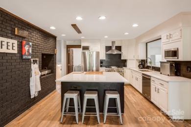 Welcome to this beautifully updated 4-bedroom, 4-bath home on Rumbling Bald Resort on Lake Lure in North Carolina - for sale on GolfHomes.com, golf home, golf lot