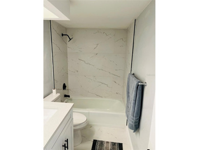 Own this exceptional, fully remodeled 2-bedroom, 2-bathroom on Cove Cay Country Club in Florida - for sale on GolfHomes.com, golf home, golf lot