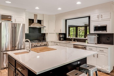 Welcome to this beautifully updated 4-bedroom, 4-bath home on Rumbling Bald Resort on Lake Lure in North Carolina - for sale on GolfHomes.com, golf home, golf lot