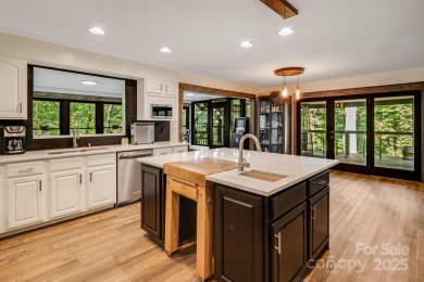 Welcome to this beautifully updated 4-bedroom, 4-bath home on Rumbling Bald Resort on Lake Lure in North Carolina - for sale on GolfHomes.com, golf home, golf lot