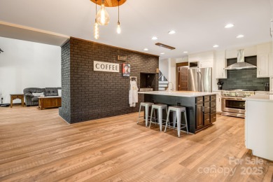 Welcome to this beautifully updated 4-bedroom, 4-bath home on Rumbling Bald Resort on Lake Lure in North Carolina - for sale on GolfHomes.com, golf home, golf lot