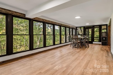 Welcome to this beautifully updated 4-bedroom, 4-bath home on Rumbling Bald Resort on Lake Lure in North Carolina - for sale on GolfHomes.com, golf home, golf lot