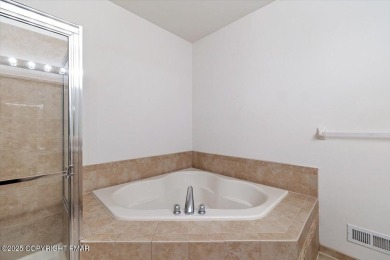 Step into sophistication with this beautifully designed End-Unit on Country Club of the Poconos Golf Course in Pennsylvania - for sale on GolfHomes.com, golf home, golf lot