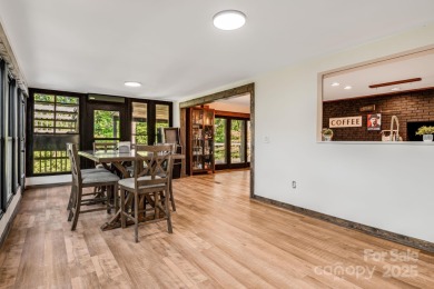 Welcome to this beautifully updated 4-bedroom, 4-bath home on Rumbling Bald Resort on Lake Lure in North Carolina - for sale on GolfHomes.com, golf home, golf lot