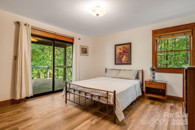 Welcome to this beautifully updated 4-bedroom, 4-bath home on Rumbling Bald Resort on Lake Lure in North Carolina - for sale on GolfHomes.com, golf home, golf lot