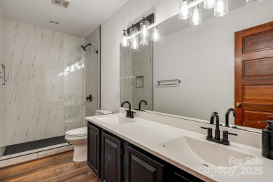 Welcome to this beautifully updated 4-bedroom, 4-bath home on Rumbling Bald Resort on Lake Lure in North Carolina - for sale on GolfHomes.com, golf home, golf lot