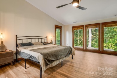Welcome to this beautifully updated 4-bedroom, 4-bath home on Rumbling Bald Resort on Lake Lure in North Carolina - for sale on GolfHomes.com, golf home, golf lot