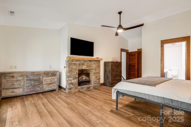 Welcome to this beautifully updated 4-bedroom, 4-bath home on Rumbling Bald Resort on Lake Lure in North Carolina - for sale on GolfHomes.com, golf home, golf lot