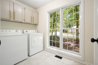 A Modern Cottage Retreat with Golf Course Views Front & Back on Canongate At Eagle Watch Golf Club in Georgia - for sale on GolfHomes.com, golf home, golf lot