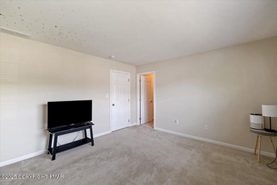 Step into sophistication with this beautifully designed End-Unit on Country Club of the Poconos Golf Course in Pennsylvania - for sale on GolfHomes.com, golf home, golf lot