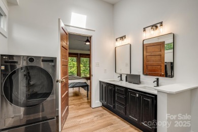 Welcome to this beautifully updated 4-bedroom, 4-bath home on Rumbling Bald Resort on Lake Lure in North Carolina - for sale on GolfHomes.com, golf home, golf lot