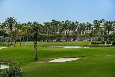 Nice golf course and water views along with westerly sunset on Isla Del Sol Yacht and Country Club in Florida - for sale on GolfHomes.com, golf home, golf lot