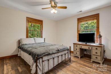 Welcome to this beautifully updated 4-bedroom, 4-bath home on Rumbling Bald Resort on Lake Lure in North Carolina - for sale on GolfHomes.com, golf home, golf lot