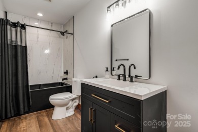 Welcome to this beautifully updated 4-bedroom, 4-bath home on Rumbling Bald Resort on Lake Lure in North Carolina - for sale on GolfHomes.com, golf home, golf lot