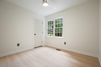 A Modern Cottage Retreat with Golf Course Views Front & Back on Canongate At Eagle Watch Golf Club in Georgia - for sale on GolfHomes.com, golf home, golf lot