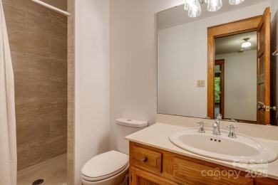 Welcome to this beautifully updated 4-bedroom, 4-bath home on Rumbling Bald Resort on Lake Lure in North Carolina - for sale on GolfHomes.com, golf home, golf lot