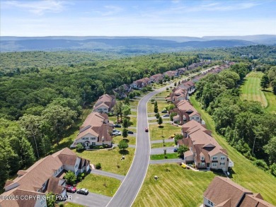 Step into sophistication with this beautifully designed End-Unit on Country Club of the Poconos Golf Course in Pennsylvania - for sale on GolfHomes.com, golf home, golf lot