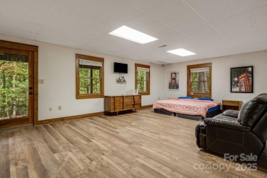 Welcome to this beautifully updated 4-bedroom, 4-bath home on Rumbling Bald Resort on Lake Lure in North Carolina - for sale on GolfHomes.com, golf home, golf lot