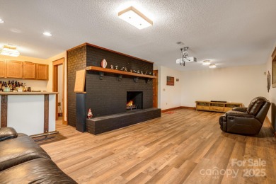 Welcome to this beautifully updated 4-bedroom, 4-bath home on Rumbling Bald Resort on Lake Lure in North Carolina - for sale on GolfHomes.com, golf home, golf lot