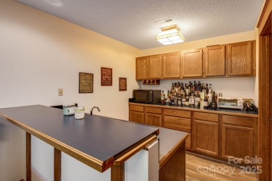 Welcome to this beautifully updated 4-bedroom, 4-bath home on Rumbling Bald Resort on Lake Lure in North Carolina - for sale on GolfHomes.com, golf home, golf lot