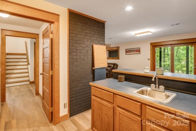 Welcome to this beautifully updated 4-bedroom, 4-bath home on Rumbling Bald Resort on Lake Lure in North Carolina - for sale on GolfHomes.com, golf home, golf lot