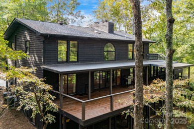 Welcome to this beautifully updated 4-bedroom, 4-bath home on Rumbling Bald Resort on Lake Lure in North Carolina - for sale on GolfHomes.com, golf home, golf lot