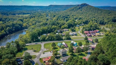 Brand New Exterior Paint completed April 2025! Adorable River on Riverland Country Club in Arkansas - for sale on GolfHomes.com, golf home, golf lot