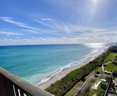 A rare vantage point offering sweeping ocean views from the on Jupiter Dunes Golf Course in Florida - for sale on GolfHomes.com, golf home, golf lot
