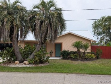 This house is located less than 1000 ft. from Three Sisters on Plantation Inn and Golf Resort  in Florida - for sale on GolfHomes.com, golf home, golf lot