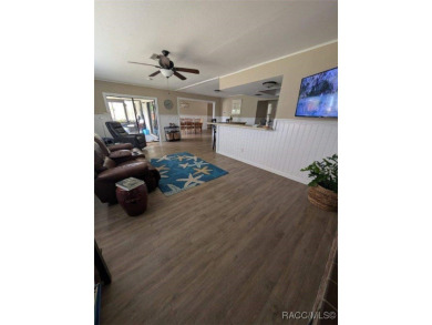 This house is located less than 1000 ft. from Three Sisters on Plantation Inn and Golf Resort  in Florida - for sale on GolfHomes.com, golf home, golf lot