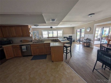 This house is located less than 1000 ft. from Three Sisters on Plantation Inn and Golf Resort  in Florida - for sale on GolfHomes.com, golf home, golf lot