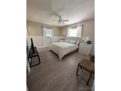 This house is located less than 1000 ft. from Three Sisters on Plantation Inn and Golf Resort  in Florida - for sale on GolfHomes.com, golf home, golf lot