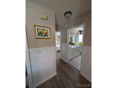 This house is located less than 1000 ft. from Three Sisters on Plantation Inn and Golf Resort  in Florida - for sale on GolfHomes.com, golf home, golf lot