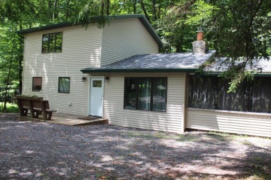 Nicely set back on a larger than average lot sits this very on The Hideout Golf in Pennsylvania - for sale on GolfHomes.com, golf home, golf lot