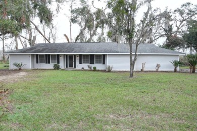 This charming home is nestled on the edge of Ocean Pond on Francis Lake Golf Club in Georgia - for sale on GolfHomes.com, golf home, golf lot