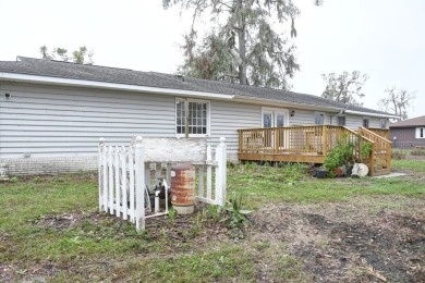 This charming home is nestled on the edge of Ocean Pond on Francis Lake Golf Club in Georgia - for sale on GolfHomes.com, golf home, golf lot