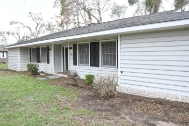 This charming home is nestled on the edge of Ocean Pond on Francis Lake Golf Club in Georgia - for sale on GolfHomes.com, golf home, golf lot