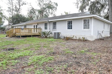 This charming home is nestled on the edge of Ocean Pond on Francis Lake Golf Club in Georgia - for sale on GolfHomes.com, golf home, golf lot