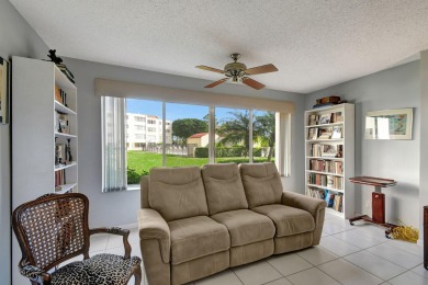 Welcome to this spacious first-floor condo, perfectly situated on Poinciana Golf Club in Florida - for sale on GolfHomes.com, golf home, golf lot