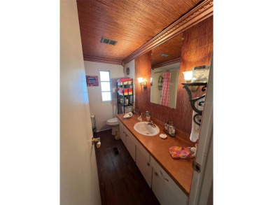 NEW REDUCED PRICE! Delight in the features of Palm Hill Country on Palm Hill Golf Club in Florida - for sale on GolfHomes.com, golf home, golf lot
