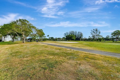 Welcome to this spacious first-floor condo, perfectly situated on Poinciana Golf Club in Florida - for sale on GolfHomes.com, golf home, golf lot