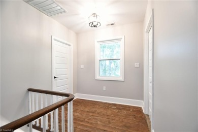 This charming countryside gem is nestled across from Colin Creek on Lake Louise Golf Club in North Carolina - for sale on GolfHomes.com, golf home, golf lot