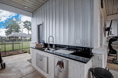 The one you've been waiting for! This stunning home offers the on Lake Caroline Golf Club in Mississippi - for sale on GolfHomes.com, golf home, golf lot