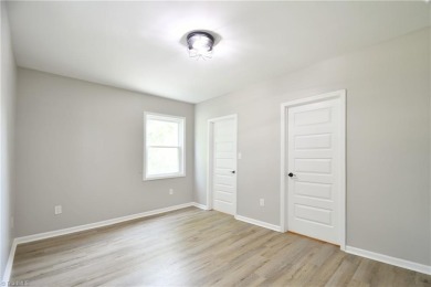 This charming countryside gem is nestled across from Colin Creek on Lake Louise Golf Club in North Carolina - for sale on GolfHomes.com, golf home, golf lot