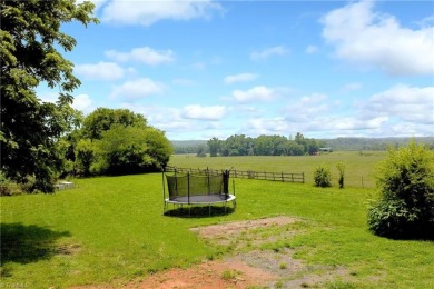 This charming countryside gem is nestled across from Colin Creek on Lake Louise Golf Club in North Carolina - for sale on GolfHomes.com, golf home, golf lot