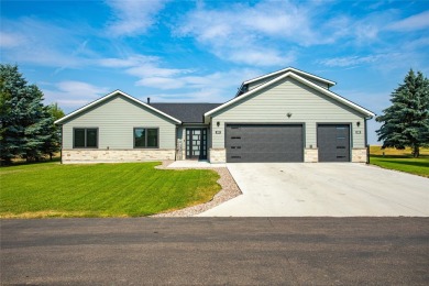 Welcome to this stunning three-bedroom + office home in Ronan on Mission Mountain Country Club in Montana - for sale on GolfHomes.com, golf home, golf lot