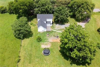 This charming countryside gem is nestled across from Colin Creek on Lake Louise Golf Club in North Carolina - for sale on GolfHomes.com, golf home, golf lot
