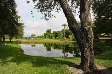 Fabulous, peaceful lake and distant golf course views grace this on The Meadows Golf and Country Club in Florida - for sale on GolfHomes.com, golf home, golf lot